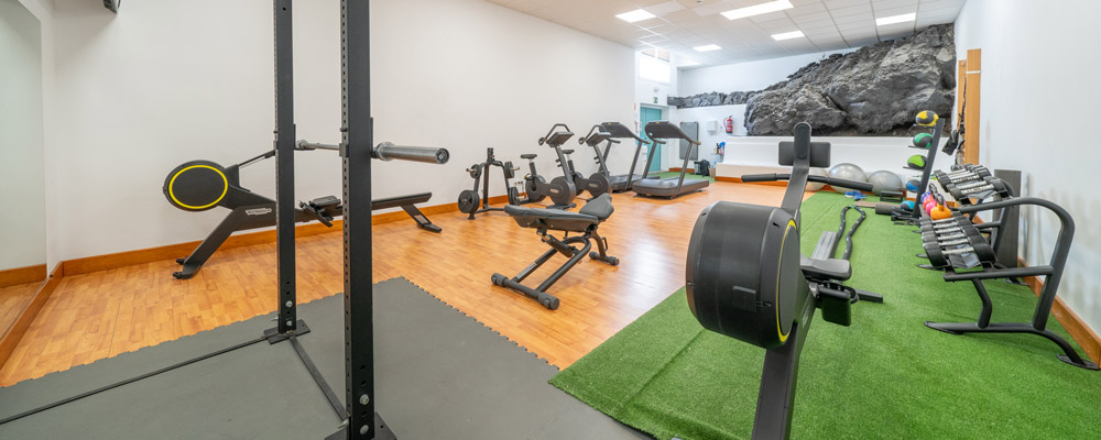 Machines and dumbbells in the gym at Relaxia Hotels Resort